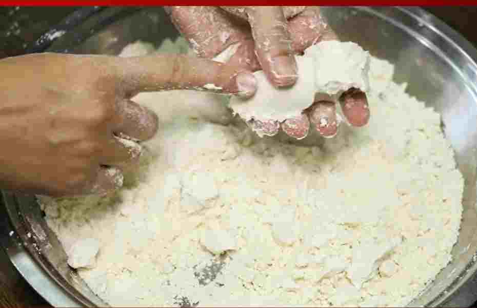 Adding enough ghee for the dough to hold shape